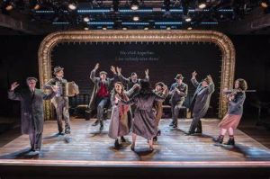 The cast dances